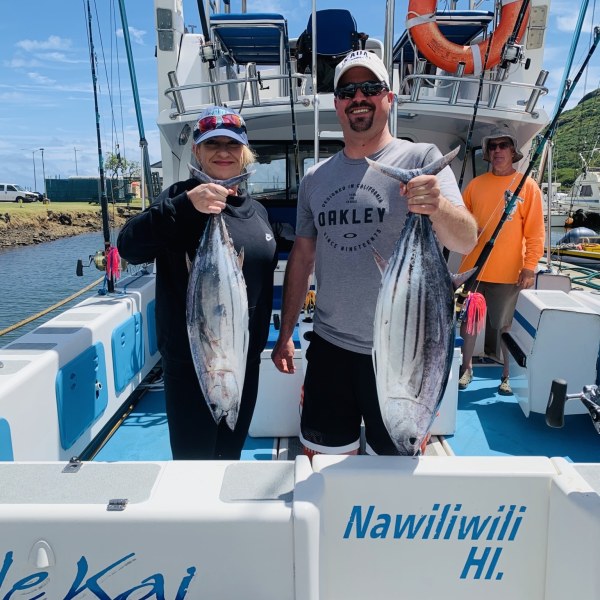 a man standing next to a boat