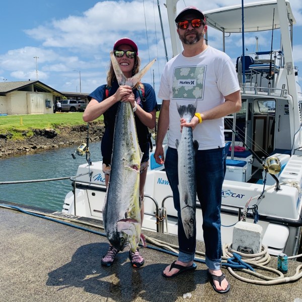 a person holding a fish