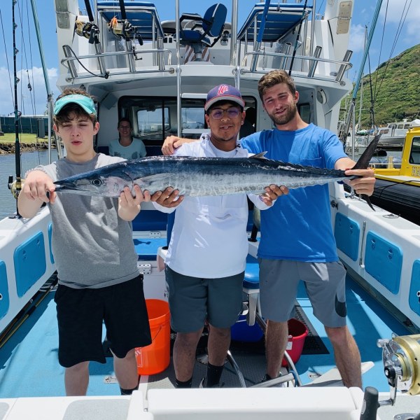 Max Charles et al. on a boat