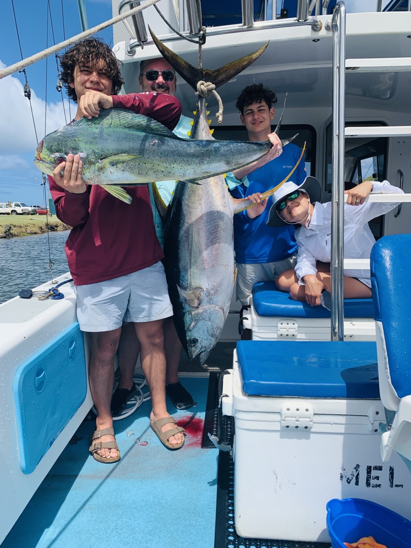 a person holding a fish on a boat