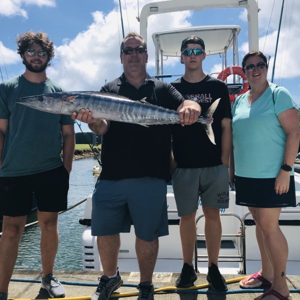 a person holding a fish