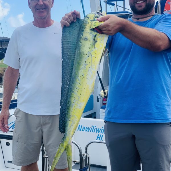 a man holding a fish