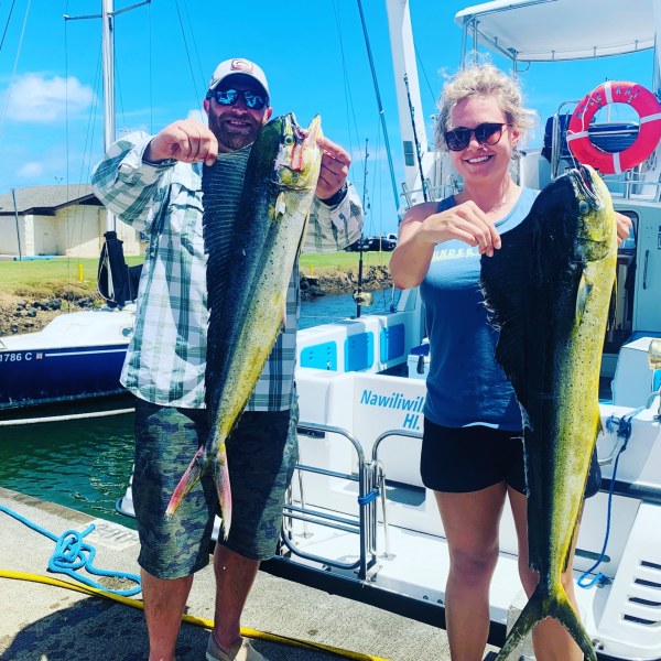 a person holding a fish