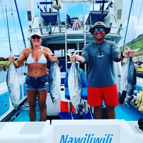 a group of people standing on a boat