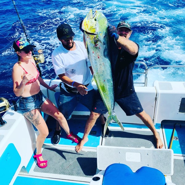 a group of people that are standing in the water