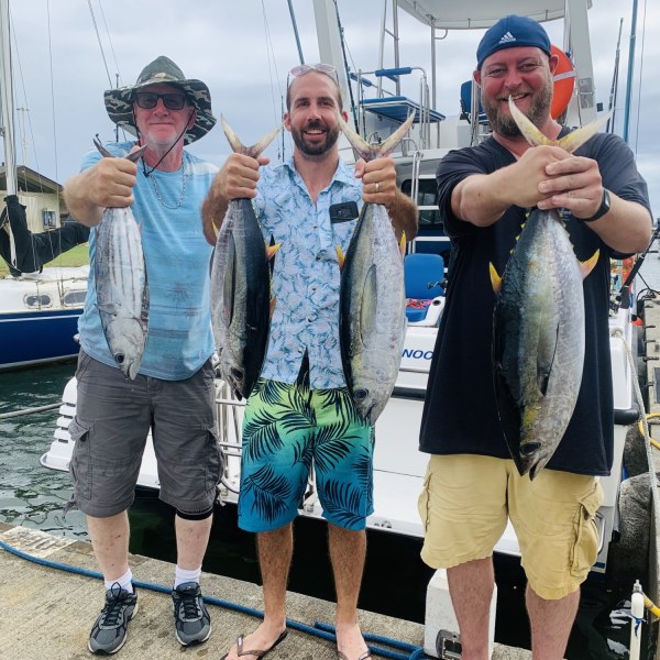 a man holding a fish