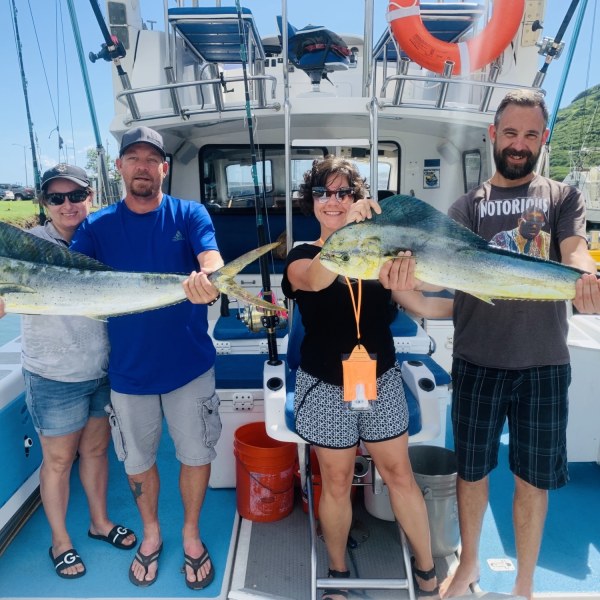 a person holding a fish on a boat