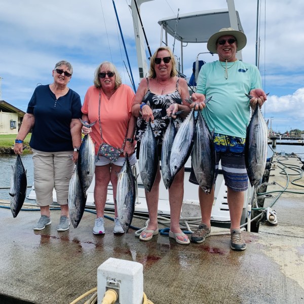 Jan Berry et al. standing on a boat