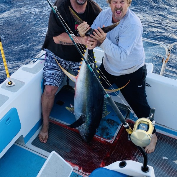 a man and a woman sitting on a boat